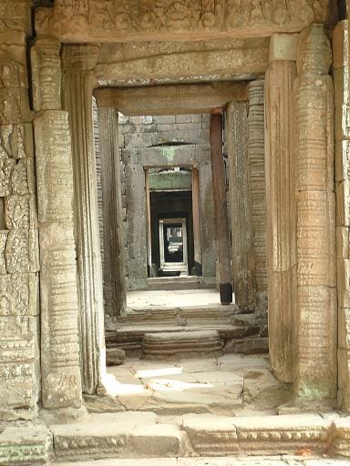 Ancient stone corridor, temple ruins.